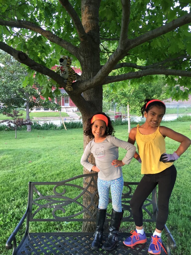 Someone placed this bench under the oak a few years ago at Bell and it's been there since. These kids think it's there to help them climb their beloved tree. They mostly use it as a ladder or a stage.