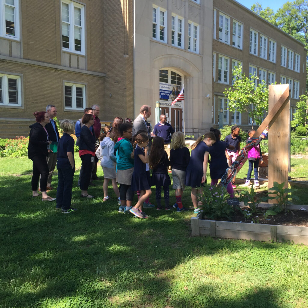 Students at Mallinckrodt leading a tour of their garden for the our Garden programs biggest supporter. Here they are showing off the bug hotel.
